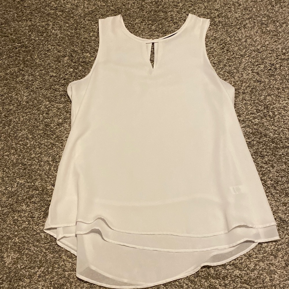 White formal woman’s tank with triangle hole through front & back.